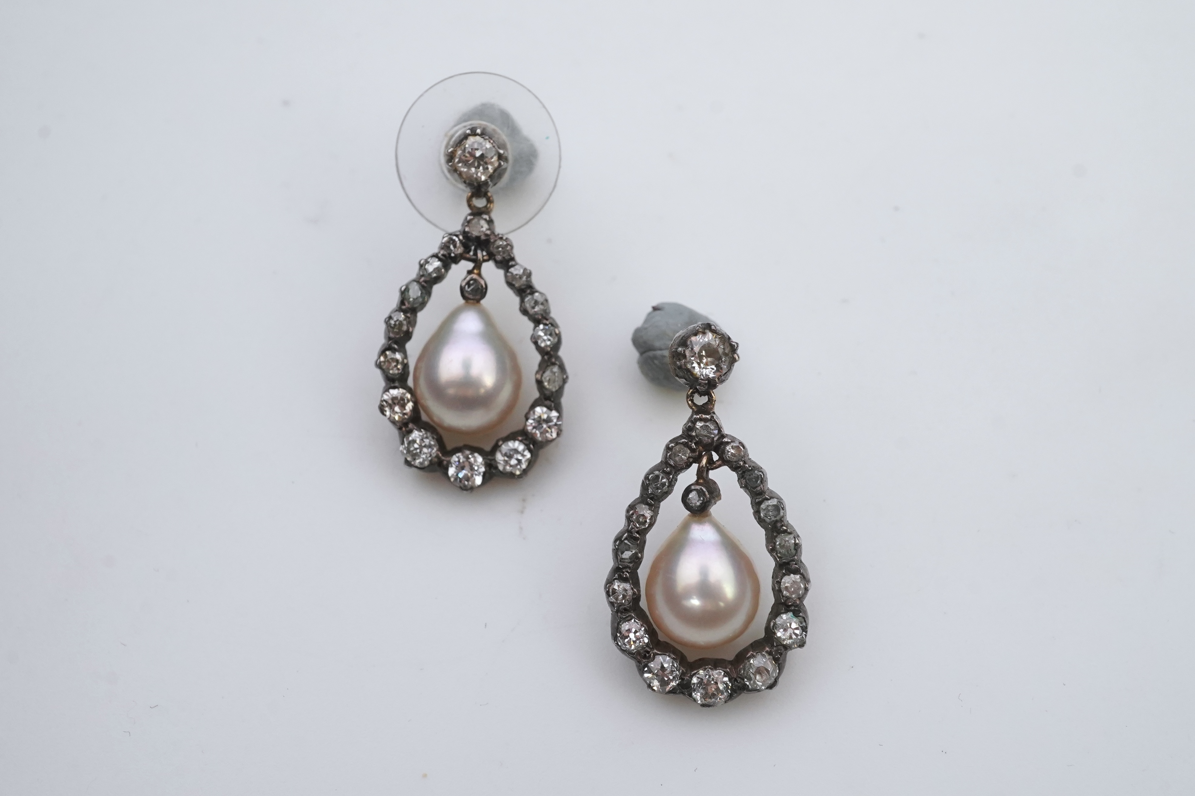 A pair of cultured pearl and diamond earrings